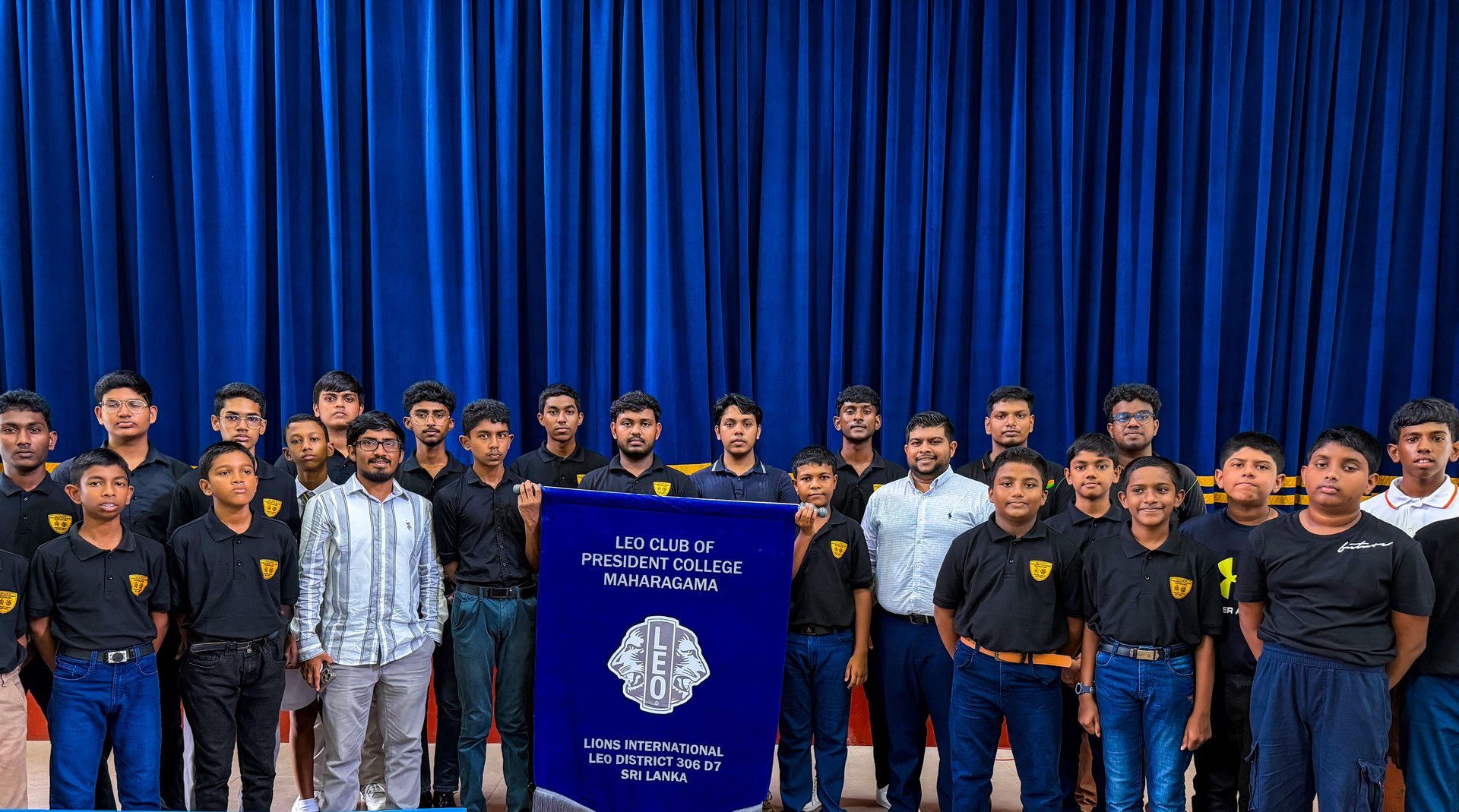 Leo Club member at a school assembly